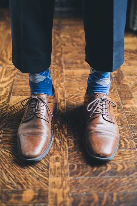 groom in blue argyle socks