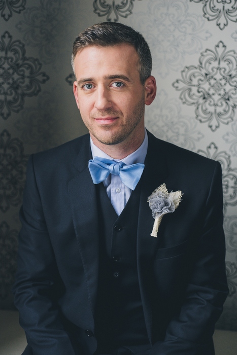 groom in pale blue bow tie