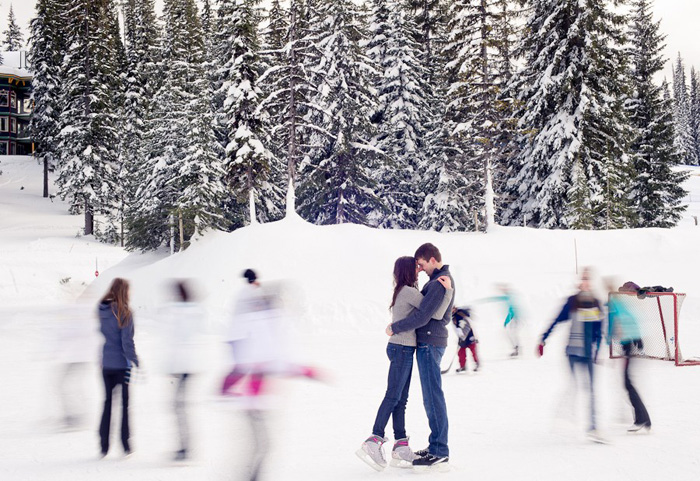 couple kissing on skating rink