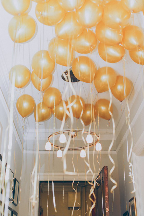 ceiling full of gold balloons