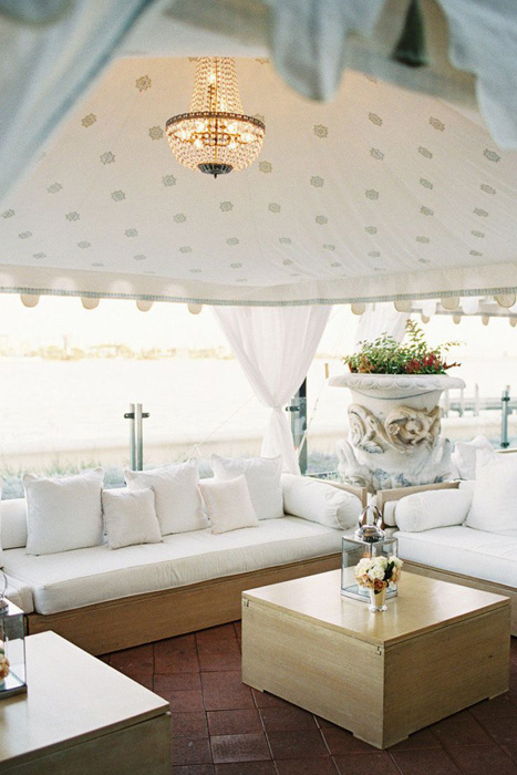 tented wedding lounge with chandelier