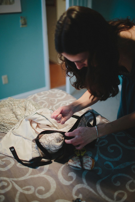 bride mending her dress