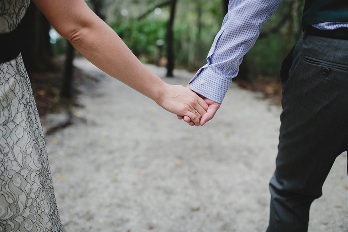 bride and groom holding hands