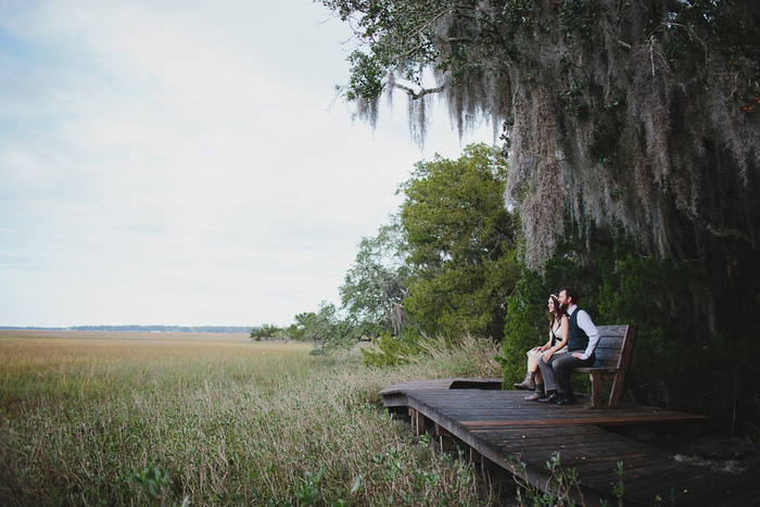 bride and groom on bench