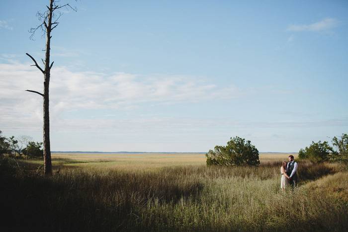 bride and groom in field