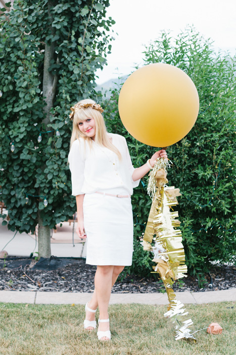 gold balloon with gold tassles