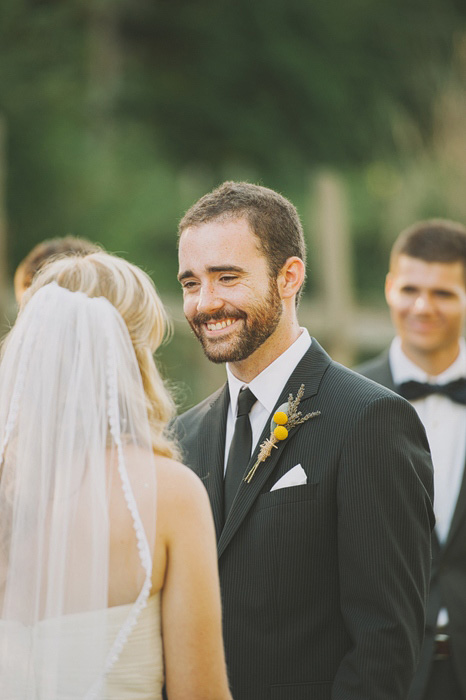 groom smiling at his bride