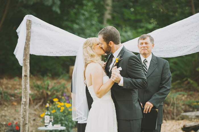 bride and groom first kiss