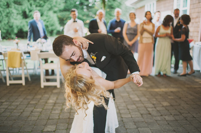 groom dipping bride