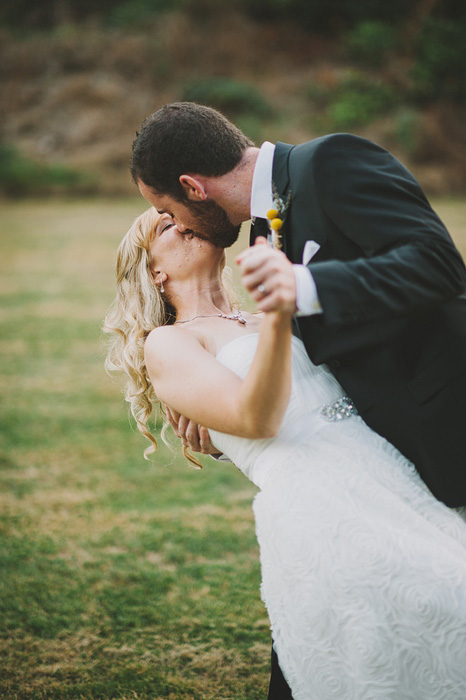 groom dipping bride