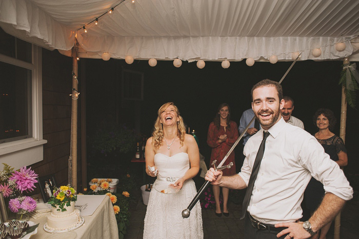 groom with cake cutting sword