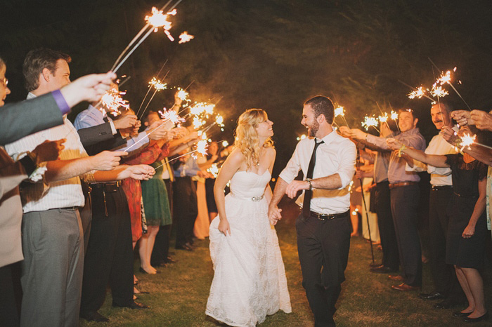 bride and groom running through sparkler send-off