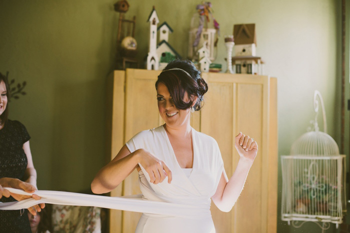 bride getting her dress on