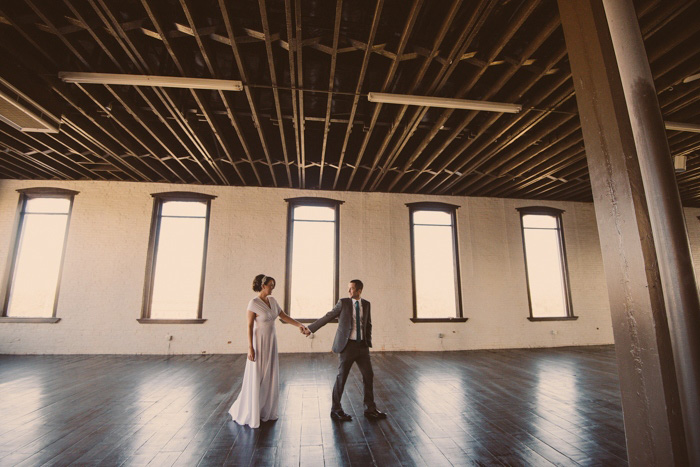 bride and groom in Texas loft