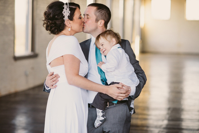 bride and groom with son