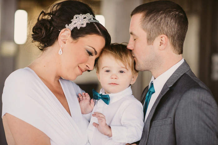 bride and groom with baby son