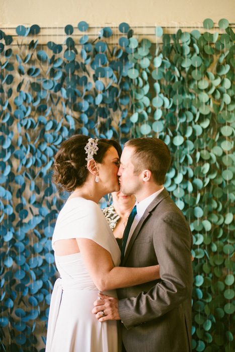 bride and groom first kiss