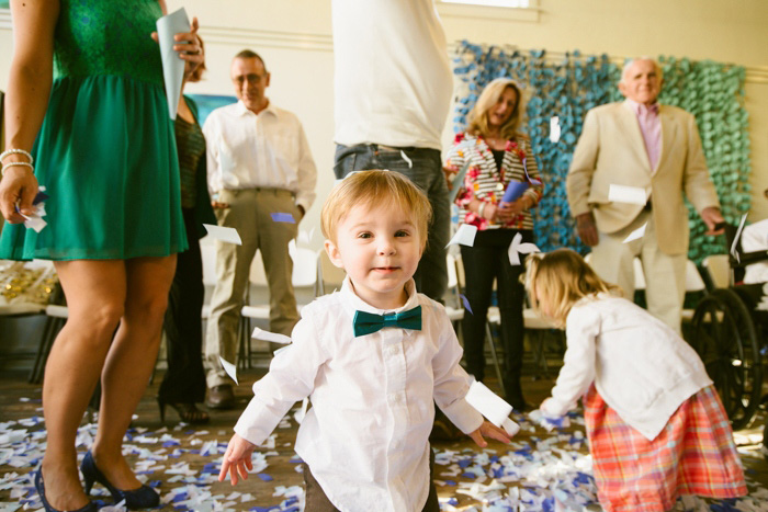 toddler playing in confetti