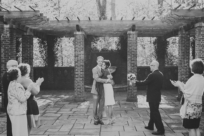 bride and groom hugging after ceremony