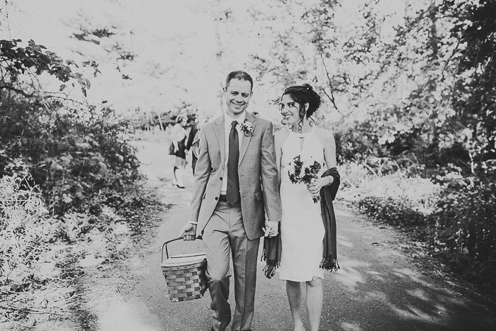 bride and groom with picnic basket