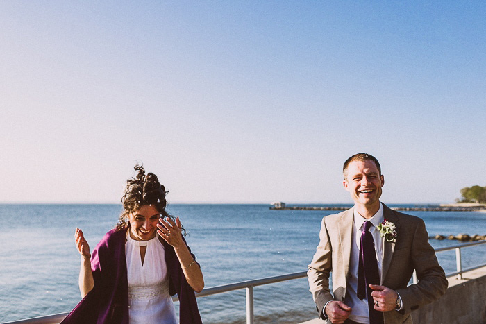 bride and groom being hit with confetti