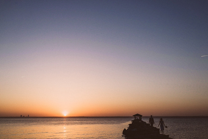 bride and groom at sunset