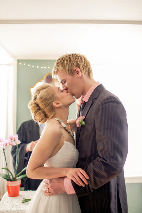 bride and groom first kiss