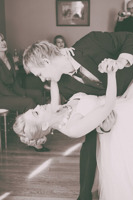 groom dipping bride