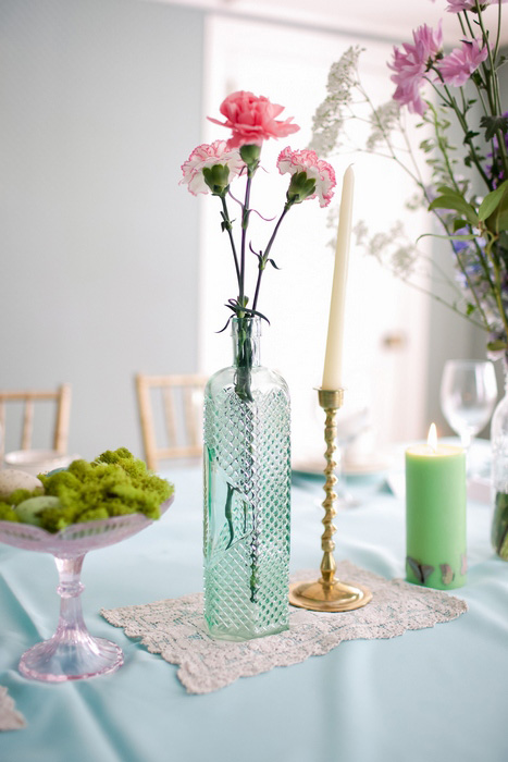 carnations in vintage blue glass vase