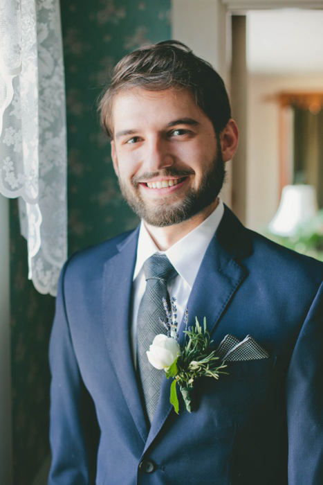 groom in navy blue suit