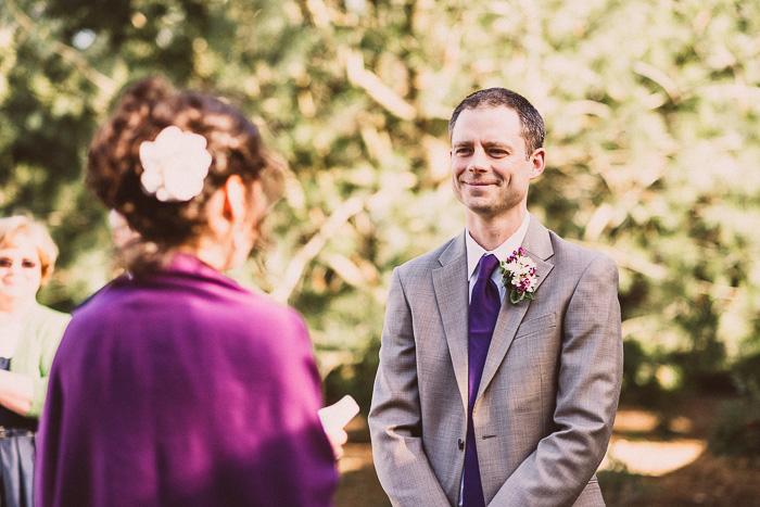 groom listening to bride's vows