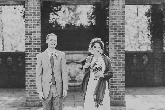 bride and groom facing guests