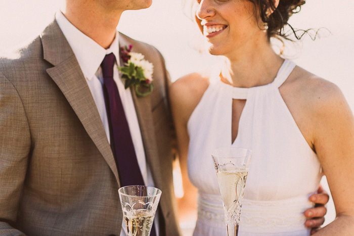 bride and groom with champagne