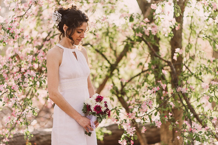 bride portrait in front of flowering tree