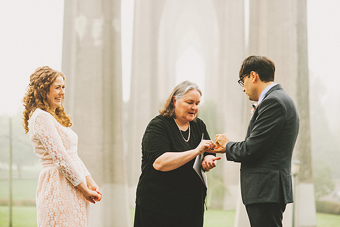 officiant giving groom rings