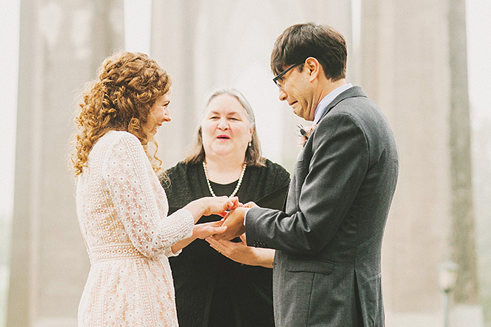 bride and groom exchanging rings