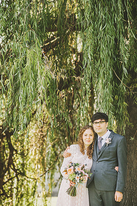 bride and groom under weeping willow