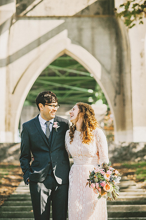 bride and groom in cathedral park