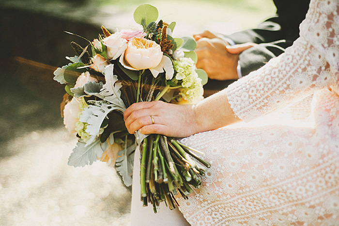 bride with rose wedding bouquet