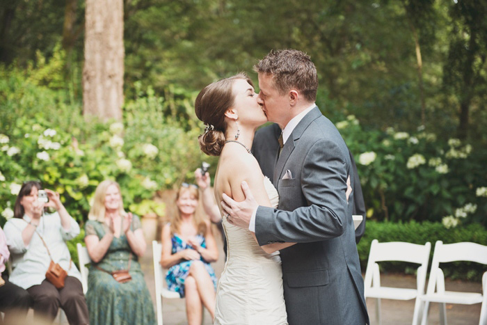 bride and groom first kiss