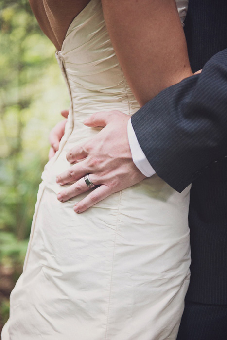 groom's hands on bride's hips