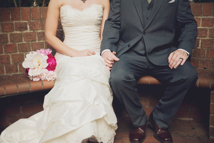 bride and groom on bench