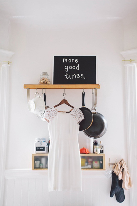 short lace wedding dress hanging up