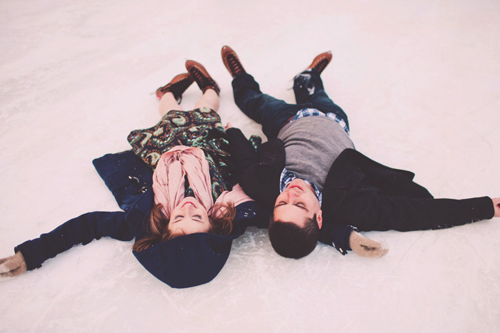 couple lying on the ice