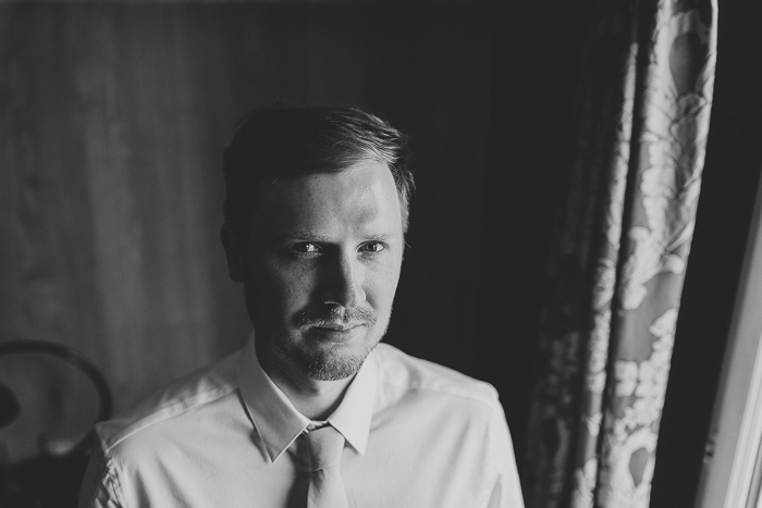 black and white groom portrait