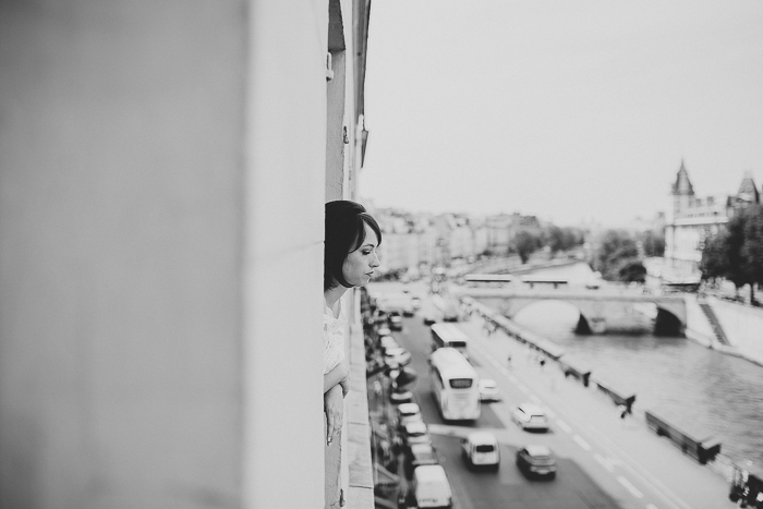 bride looking out Paris window