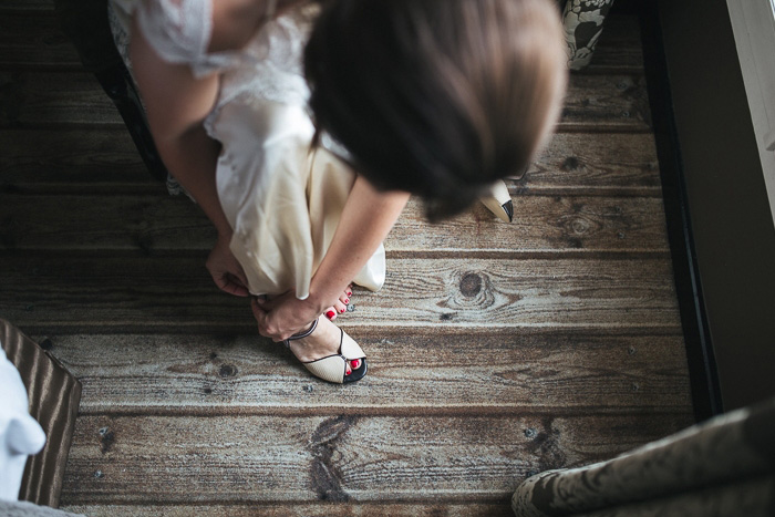 bride putting on her shoes