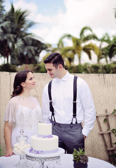 bride and groom with wedding cake