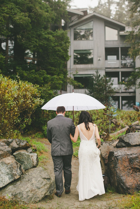 bride and groom walking balk to the inn