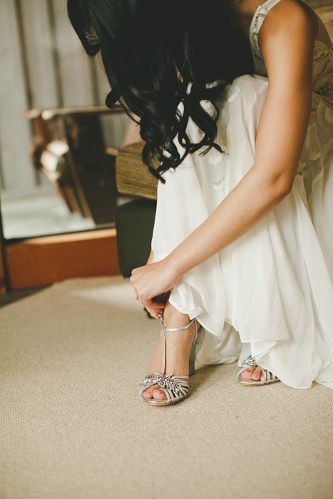 bride putting on her shoes